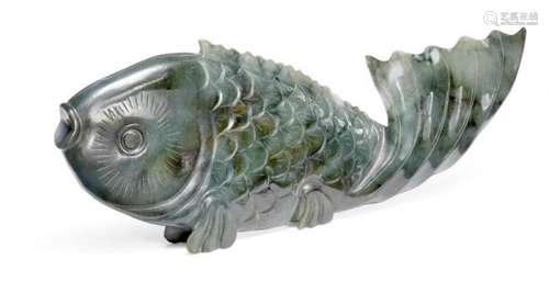 A Chinese green and white jade carp, finely worked to resemble scales, flanked by a [...]