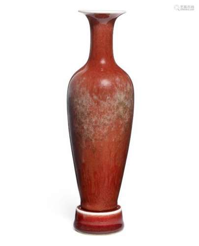 A Chinese red glazed vase of slender tapering form. Vase marked Kangxi, but 19th [...]