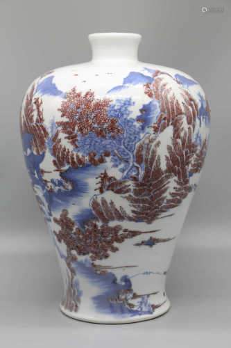 Plum vase with blue and white underglaze and red landscape pattern in Qing Dynasty