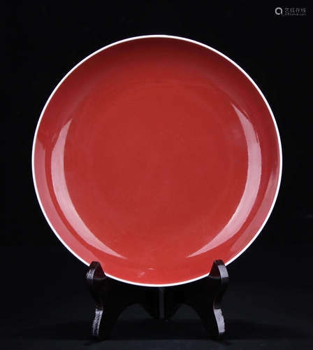 A CEREMONY RED GLAZED PLATE