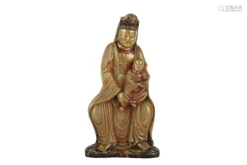 A CHINESE SOAPSTONE FIGURE OF GUANYIN AND CHILD.
