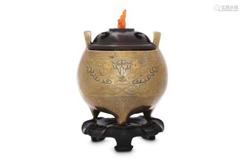 A CHINESE GOLD AND SILVER-INLAID 'TAOTIE MASK' INCENSE BURNER.