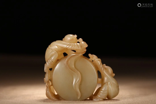 A JADE CARVING OF 'KIDS BEATING A DRUM'