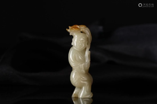 A RUSSET JADE CARVING OF A KID
