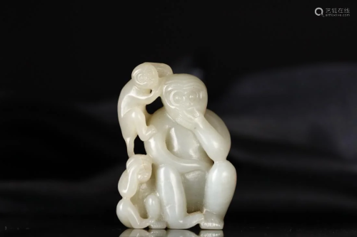A CHINESE CARVED JADE 'MONKEYS' ORNA…