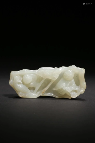 A JADE CARVING 'KID' BRUSH REST