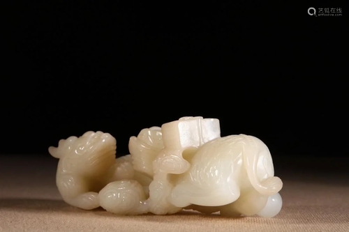 A WHITE JADE CARVING 'QILIN & TREAS…