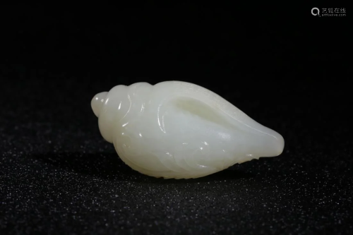 A WHITE JADE CARVING 'CONCH' ORN…
