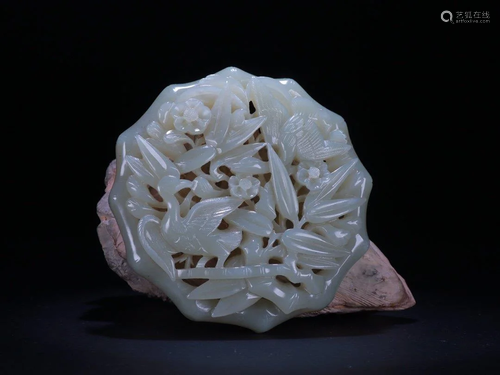 AN OPENWORK JADE CARVING 'FLOWER …