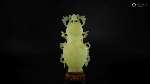 A 'XIU' JADE CARVING VASE ON WO…