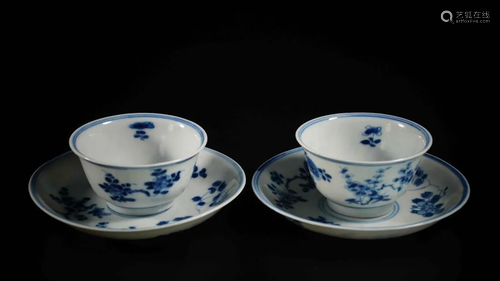 PAIR OF QING BLUE AND WHITE FLORAL CUPS…