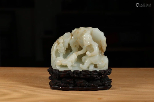 A JADE CARVING 'FIGURE AND LION' ORN…