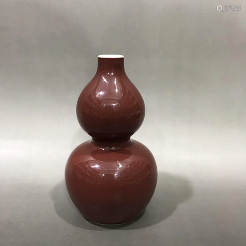 A RED GLAZED PORCELAIN DOUBLE GOU…