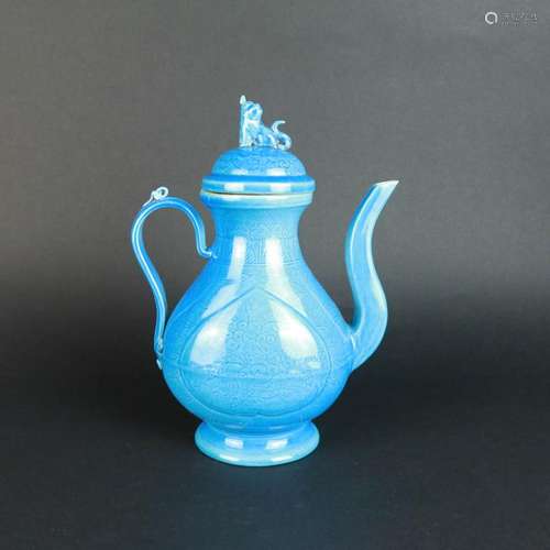 A Peacock Blue Glaze Carved Porcelain Ewer