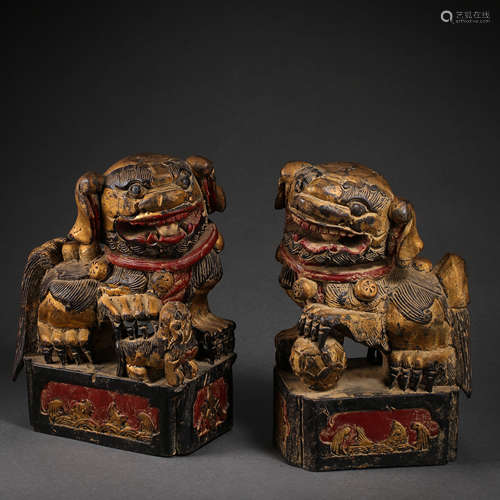 A PAIR OF ANCIENT CHINESE WOOD CARVED BEASTS