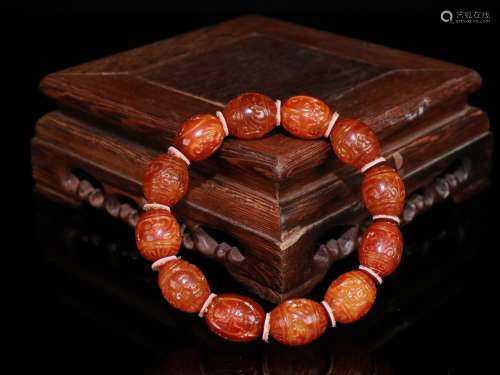 An Amber Dragon Carved Bracelet