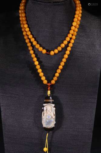 A Chinese Tibetan Amber 2-Eye Dzi Necklace