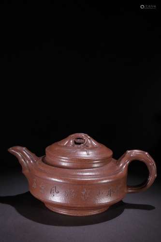 A Chinese Zisha Teapot With Potery Carving