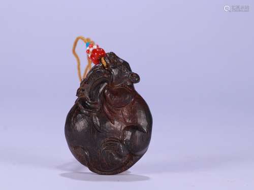 A Chinese Agarwood Beast Carved Pendant