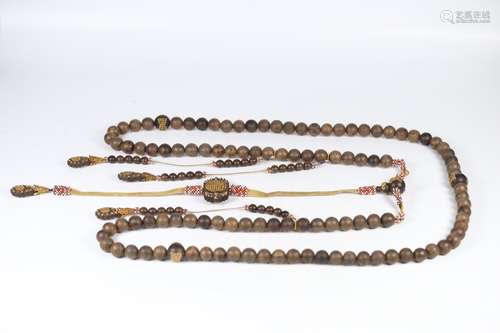 A Chinese Agarwood Rosary Decorated With Golden Beads