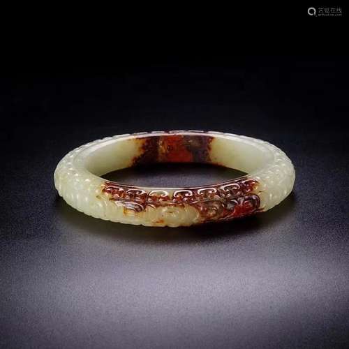 A Chinese Hetian Jade Lotus Pattern Bangle