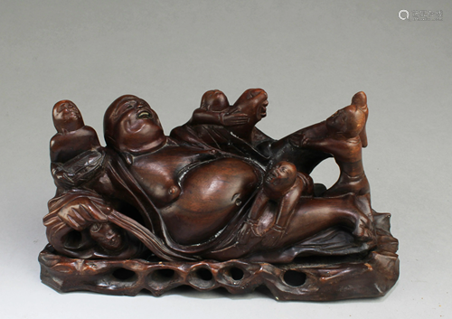 A Carved Wooden Buddha Figurine