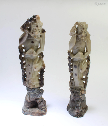 A Pair of Carved Stone Figurines