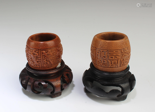 A Group of Two Carved Walnut Ornament