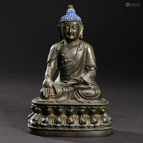 A BRONZE SAKYAMUNI STATUE