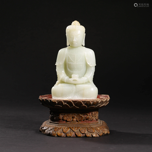 A WHITE JADE SAKYAMUNI STATUE