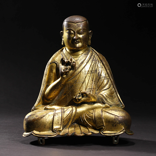 A GILT BRONZE GURU STATUE