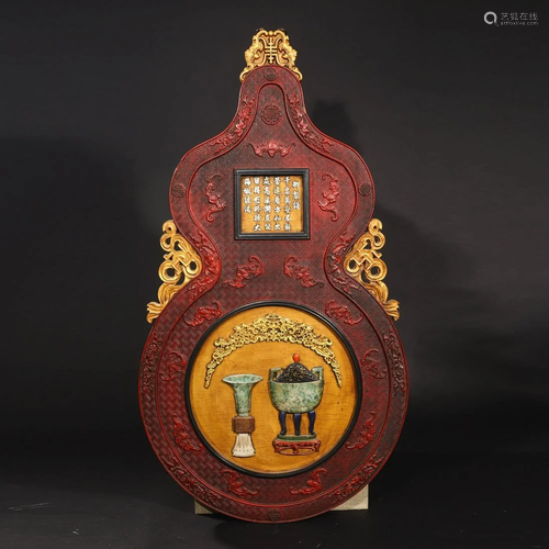 AN IMPERIAL LACQUERWARE INSCRIBED GOURD SHAPED WALL