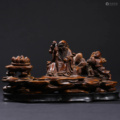 A CARVED BOXWOOD CHILDREN & BEAST ORNAMENT