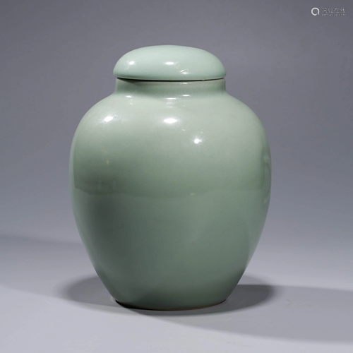 A CELEDON GLAZED PORCELAIN JAR & COVER