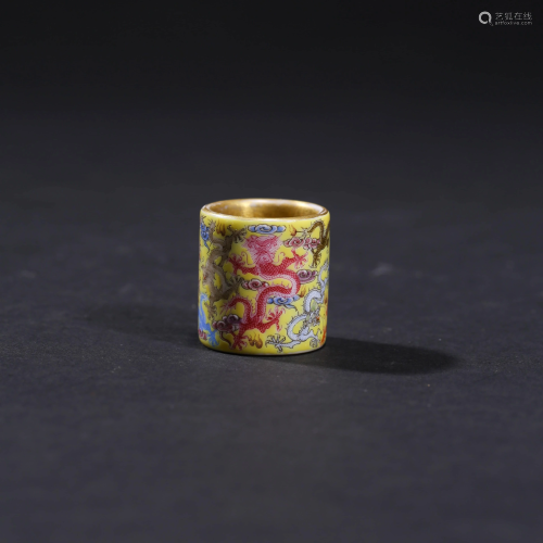 A YELLOW GROUND FAMILLE ROSE PORCELAIN DRAGON RING
