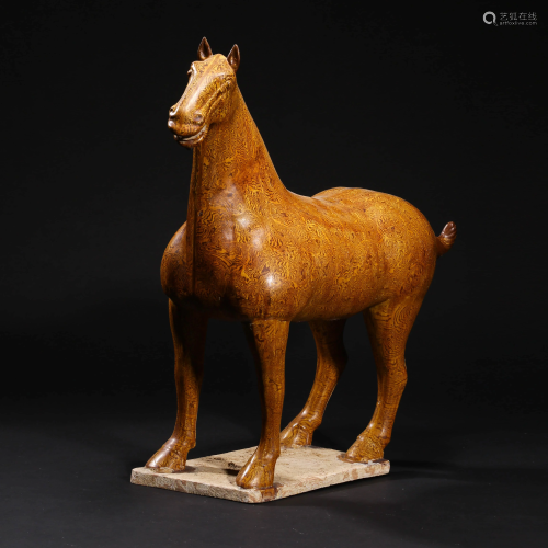 A YELLOW GLAZED STANDING HORSE