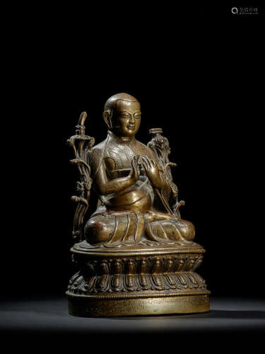A SILVER AND COPPER INLAID BRASS FIGURE OF TSULTRIM PELZANG TIBET, 16TH CENTURY