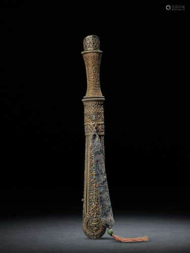 A PARCEL GILT SILVER AND GILT COPPER ALLOY AND IRON CEREMONIAL KNIFE AND SCABBARD BHUTAN, 19TH CENTURY