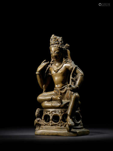 A SILVER AND COPPER INLAID BRASS FIGURE OF AVALOKITESHVARA SWAT VALLEY OR KASHMIR, CIRCA 9TH CENTURY