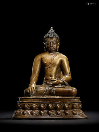A SILVER AND COPPER INLAID COPPER ALLOY FIGURE OF BUDDHA SHAKYAMUNI TIBET, 13TH CENTURY