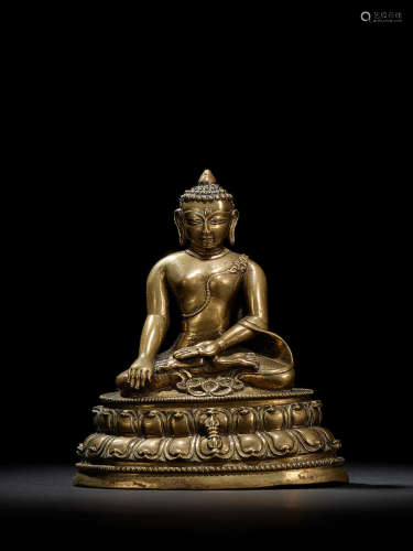 A BRASS FIGURE OF BUDDHA VAJRASANA TIBET, 12TH CENTURY