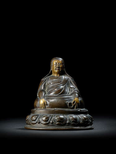 A COPPER ALLOY FIGURE OF A LAMA TIBET, CIRCA 16TH CENTURY