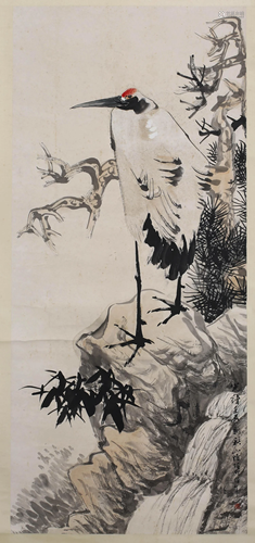 A SCROLL PAINTING OF A CRANE AND PINES BY REN BO NIAN