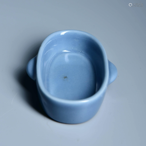 A BLUE GLAZED HUMAN FACE WASHER WITH THE MARK 'DA QING