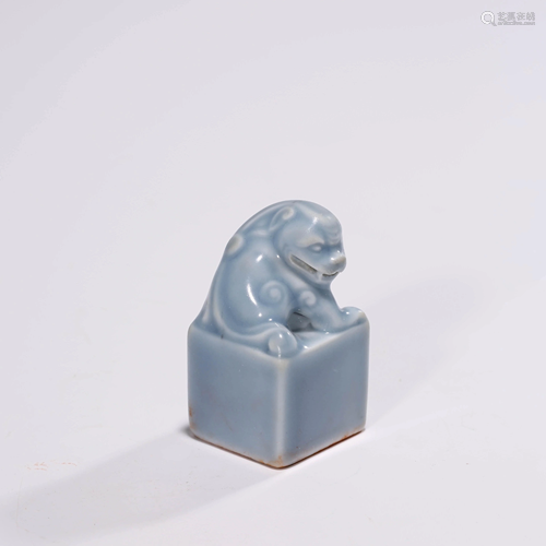 A SKY BLUE GLAZED ANIMAL SEAL AND BOX