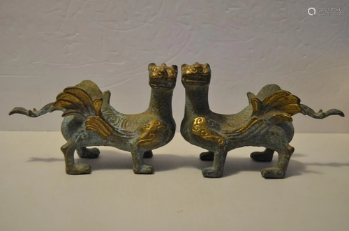 A pair of Chinese gilt bronze unicorns