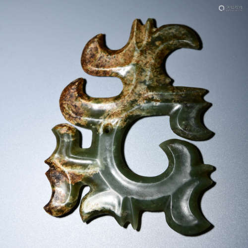 A JADE CARVED CLOUD SHAPED PENDANT