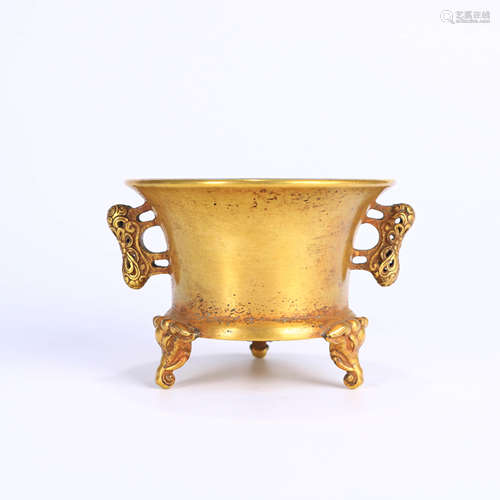 A GILD BRONZE THREE-LEGGED INCENSE BURNER