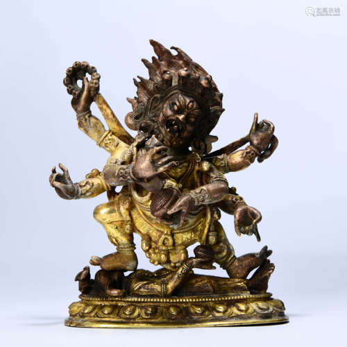 A GILD BRONZE STATUE OF MAHĀKĀLA