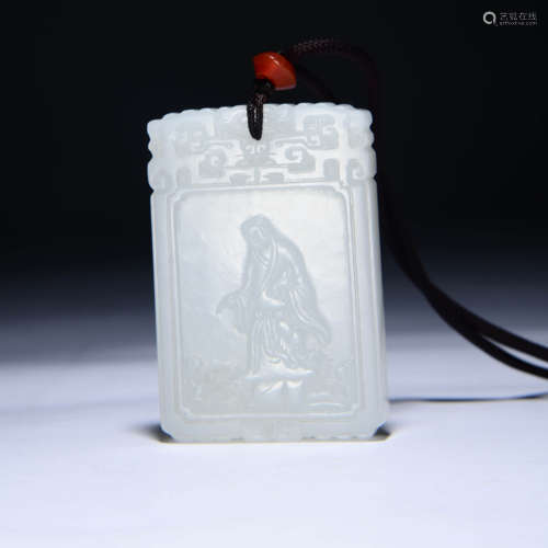 AN INSCRIBED JADE PENDANT